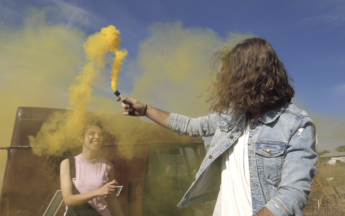 Playing with a yellow smoke bomb 1 playing with a yellow smoke bomb
