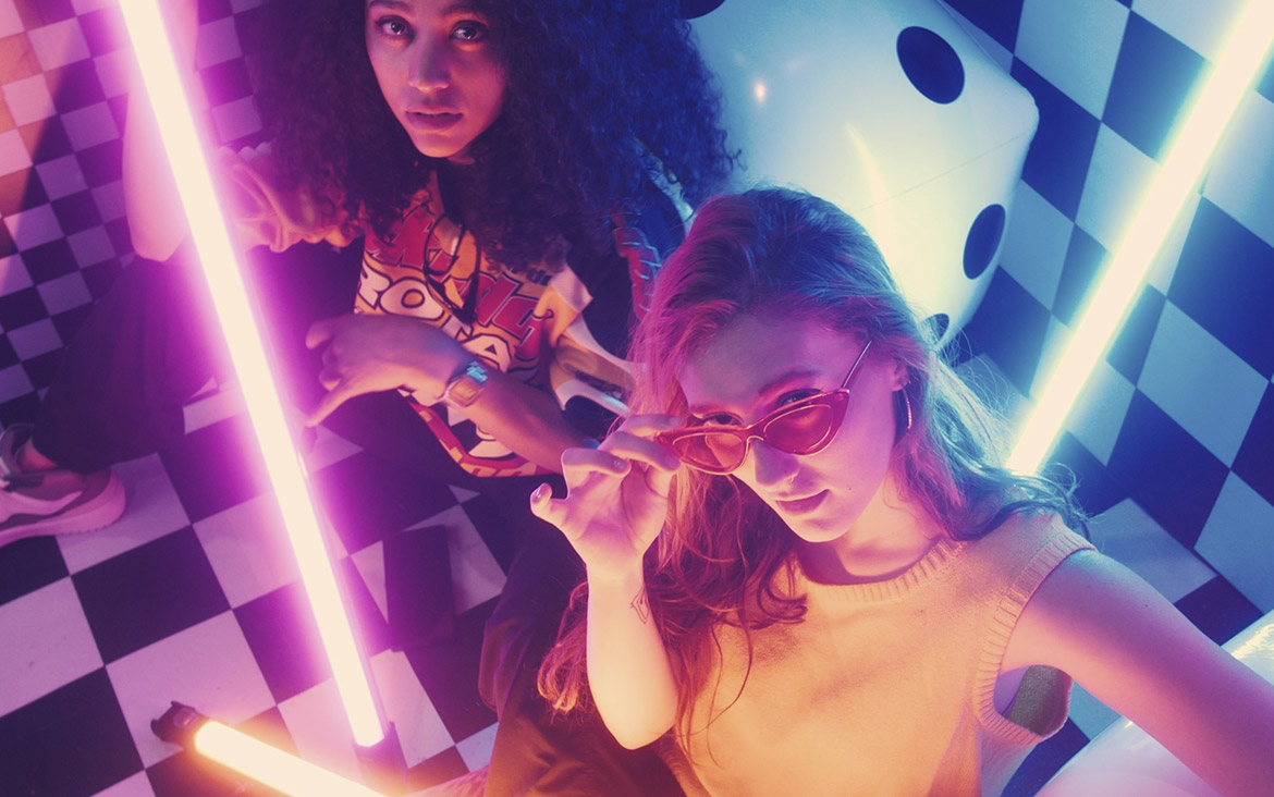 Urban girls between bars of colored light 1 urban girls between bars of colored light